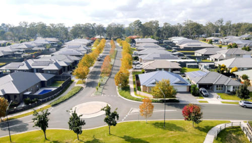 A peaceful family-oriented neighborhood surrounded by lush greenery at Appin Grove